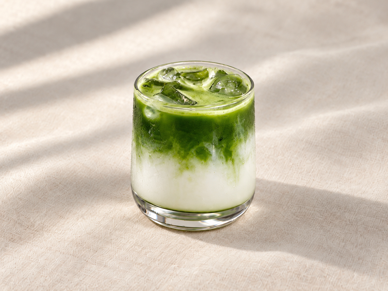 Iced matcha latte with layers of green matcha and white milk